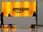 A file photo of people standing in the lobby for Amazon offices in New York. A file photo of people standing in the lobby for Amazon offices in New York.