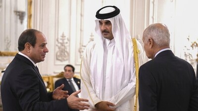 Egyptian President Abdel Fattah el-Sissi, left, and Secretary-General Ahmed Aboul Gheit, talk to Qatari Emir Sheikh Tamim bin Hamad Al Thani, during the International peace summit at the New Administrative Capital, just outside Cairo. (AP) Egyptian President Abdel Fattah el-Sissi, left, and Secretary-General Ahmed Aboul Gheit, talk to Qatari Emir Sheikh Tamim bin Hamad Al Thani, during the International peace summit at the New Administrative Capital, just outside Cairo. (AP)