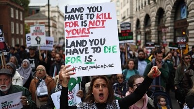People take part in a 'March For Palestine', in London on October 21, 2023, to "demand an end to the war on Gaza". The UK has pledged its support for Israel following the bloody attacks by Hamas, which killed more than 1,400 people, and has announced that humanitarian aid to the Palestinians will be increased by a third -- an extra �10 million pounds ($12 million). Israel is relentlessly bombing the small, crowded territory of Gaza, where more than 3,400 people have been killed, most of them Palestinian civilians, according to the local authorities. (Photo by HENRY NICHOLLS / AFP) (AFP)