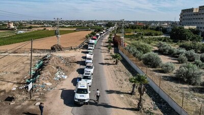This aerial view shows humanitarian aid trucks arriving from Egypt after having crossed through the Rafah border crossing. (AFP) This aerial view shows humanitarian aid trucks arriving from Egypt after having crossed through the Rafah border crossing. (AFP)