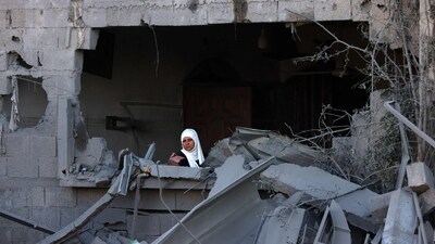 Israel-Hamas War: A woman sits amid the rubble of a building destroyed in an Israeli bombardment in Rafah in the southern Gaza Strip. (AFP) Israel-Hamas War: A woman sits amid the rubble of a building destroyed in an Israeli bombardment in Rafah in the southern Gaza Strip. (AFP)