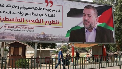 Israel-Hamas War: A billboard depicting Saleh al-Aruri, a senior leader of the Palestinian Hamas movement, is pictured in Gaza City. (AFP)