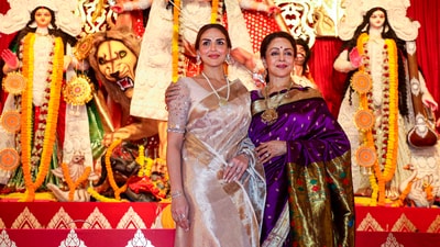 Actors Hema Malini and Esha Deol pose for photos at a pandal of North Bombay Sarbojanin Durga Puja, in Mumbai, Saturday, Oct. 21, 2023.&nbsp; (PTI)