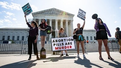 Anti-abortion rights demonstrators outside the US Supreme Court in Washington, DC, US, on Friday, April 21, 2023. The Supreme Court extended a temporary hold on new restrictions imposed by a federal judge in Texas on a widely used abortion pill, giving the justices until today to decide how to handle the case. Photographer: Valerie Plesch/Bloomberg (Bloomberg) Anti-abortion rights demonstrators outside the US Supreme Court in Washington, DC, US, on Friday, April 21, 2023. The Supreme Court extended a temporary hold on new restrictions imposed by a federal judge in Texas on a widely used abortion pill, giving the justices until today to decide how to handle the case. Photographer: Valerie Plesch/Bloomberg (Bloomberg)