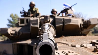 Israeli soldiers sit on a Merkava tank as they man a position at an undisclosed location on the border with Lebanon. (AFP) Israeli soldiers sit on a Merkava tank as they man a position at an undisclosed location on the border with Lebanon. (AFP)