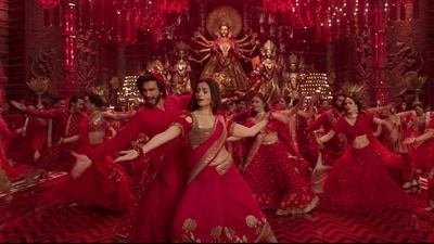 5. In the Dhindora Baje song, the red and white Bengali Korial saree was changed to red and gold to add a touch of drama and elegance, with the usage of gold highlights, to wonderfully portray Rani's Bengali ancestry. For this a traditional Jamdani, a delicate muslin fabric, was used. This look can also be incorporated by brides to stand apart during occasions and festivities. This movie has definitely raised the bar when it comes to Indian and bridal wear, leaving fashion enthusiasts excited to recreate these looks for their own special occasions. (Screengrab) 5. In the Dhindora Baje song, the red and white Bengali Korial saree was changed to red and gold to add a touch of drama and elegance, with the usage of gold highlights, to wonderfully portray Rani's Bengali ancestry. For this a traditional Jamdani, a delicate muslin fabric, was used. This look can also be incorporated by brides to stand apart during occasions and festivities. This movie has definitely raised the bar when it comes to Indian and bridal wear, leaving fashion enthusiasts excited to recreate these looks for their own special occasions. (Screengrab)