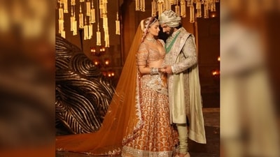 1. One standout outfit from the movie is the ‘most-talked’ gorgeous bridal orange-golden lehenga worn by the leading lady — Alia Bhatt. It features intricate hand embroidery and embellishments, exuding opulence and grandeur. The vibrant colour combinations of burnt orange with resplendent golden embroidery and the use of luxurious fabrics give it a regal feel, making it an ideal choice for a bride looking to make a statement on her special day. (Instagram/@manishmalhotra05) 1. One standout outfit from the movie is the ‘most-talked’ gorgeous bridal orange-golden lehenga worn by the leading lady — Alia Bhatt. It features intricate hand embroidery and embellishments, exuding opulence and grandeur. The vibrant colour combinations of burnt orange with resplendent golden embroidery and the use of luxurious fabrics give it a regal feel, making it an ideal choice for a bride looking to make a statement on her special day. (Instagram/@manishmalhotra05)