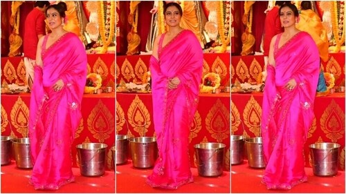 Kajol wears a Rani pink saree and a sleeveless blouse for her visit to Durga Puja pandal. (HT Photo/Varinder Chawla ) Kajol wears a Rani pink saree and a sleeveless blouse for her visit to Durga Puja pandal. (HT Photo/Varinder Chawla )