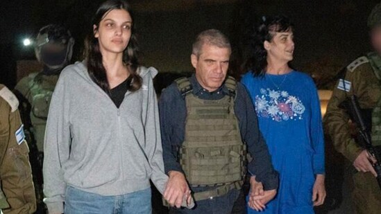 In this photo provided by the Government of Israel, Judith Raanan, right, and her 17-year-old daughter Natalie are escorted by Israeli soldiers and Gal Hirsch, Prime Minister Benjamin Netanyahu's special coordinator for returning the hostages, as they return to Israel from captivity in the Gaza Strip, Friday, Oct. 20, 2023. Hamas released the pair in what it said was a goodwill gesture late Friday, nearly two weeks after they were captured in a bloody cross-border raid by the Islamic militant group. The Hamas attack sparked a war that is entering its third week, and Hamas is believed to still be holding some 200 people hostage. (Government of Israel via AP Photo) (AP)