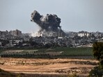 A picture taken from Sderot on October 21, 2023, shows smoke rising over buildings in the Gaza Strip during an Israeli strike. A picture taken from Sderot on October 21, 2023, shows smoke rising over buildings in the Gaza Strip during an Israeli strike.