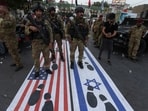 Security forces stand near the entrance of the Green Zone, home to the US embassy and other missions, in Baghdad, Iraq.