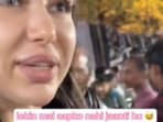 The image shows a Russian Vlogger filming her experience while visiting Sarojini Nagar Market in Delhi. The image shows a Russian Vlogger filming her experience while visiting Sarojini Nagar Market in Delhi.
