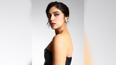 With the help of hairstylist Sanky Evrus, Bhumi styled her lush locks into a side-parted bun, leaving a section of her hair open to beautifully frame her face and complement her look. (Instagram/@bhumipednekar) With the help of hairstylist Sanky Evrus, Bhumi styled her lush locks into a side-parted bun, leaving a section of her hair open to beautifully frame her face and complement her look. (Instagram/@bhumipednekar)