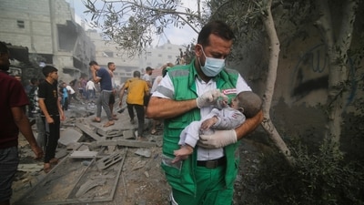 Israel-Hamas War: Palestinian medic takes a baby pulled out of buildings destroyed in the Israeli bombardment of the Gaza Strip in Rafah. (AP) Israel-Hamas War: Palestinian medic takes a baby pulled out of buildings destroyed in the Israeli bombardment of the Gaza Strip in Rafah. (AP)