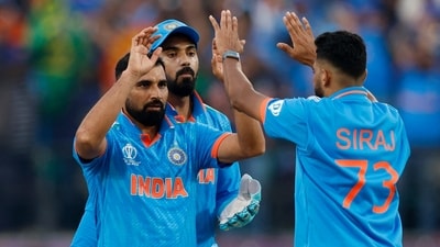 Mohammed Shami celebrates with Mohammed Siraj after taking a wicket (REUTERS)