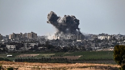 A picture taken from Sderot on October 21, 2023, shows smoke rising over buildings in the Gaza Strip during an Israeli strike. (AFP) A picture taken from Sderot on October 21, 2023, shows smoke rising over buildings in the Gaza Strip during an Israeli strike. (AFP)