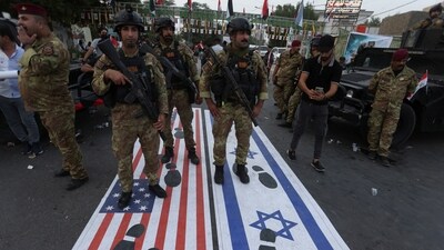 Security forces stand near the entrance of the Green Zone, home to the US embassy and other missions, in Baghdad, Iraq. (Reuters)