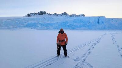 Indo-Canadian researcher Vishnu Nandan stands on the Antarctic sea ice with glacial ice cliffs in the background. (Robbie Mallett/ University of Manitoba) Indo-Canadian researcher Vishnu Nandan stands on the Antarctic sea ice with glacial ice cliffs in the background. (Robbie Mallett/ University of Manitoba)