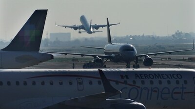 Passenger planes take off from Benito Juárez International Airport in Mexico City, (AP)