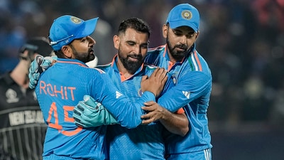 Mohammed Shami with with captain Rohit Sharma and KL Rahul celebrates the wicket of New Zealand's Daryl Mitchell (PTI) Mohammed Shami with with captain Rohit Sharma and KL Rahul celebrates the wicket of New Zealand's Daryl Mitchell (PTI)