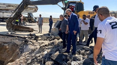 Syria's Prime Minister Hussein Arnous inspects damage at the runway of Damascus International Airport after an Israeli air strike. (File/ AFP)