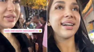 The image shows a Russian Vlogger filming her experience while visiting Sarojini Nagar Market in Delhi. (YouTube/@koko_kvv) The image shows a Russian Vlogger filming her experience while visiting Sarojini Nagar Market in Delhi. (YouTube/@koko_kvv)
