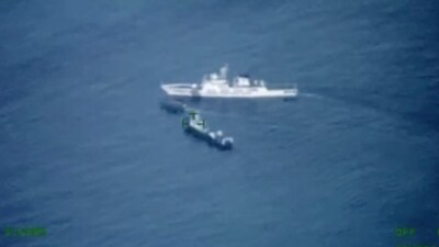 A Philippines supply boat, center, sails near a Chinese coast guard ship, top, and a Chinese militia vessel off Second Thomas Shoal, locally called Ayungin Shoal, at the disputed South China Sea. (AP) A Philippines supply boat, center, sails near a Chinese coast guard ship, top, and a Chinese militia vessel off Second Thomas Shoal, locally called Ayungin Shoal, at the disputed South China Sea. (AP)