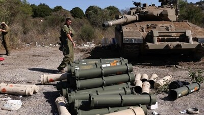 Israel-Hamas War: Israeli soldiers stand near a Merkava tank as they man a position at an undisclosed location on the border with Lebanon. (AFP) Israel-Hamas War: Israeli soldiers stand near a Merkava tank as they man a position at an undisclosed location on the border with Lebanon. (AFP)