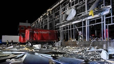 This picture shows Ukrainian rescuers working among the debris of a mail depot building following missile strikes at the village of Korotych in Kharkiv region. (AFP) This picture shows Ukrainian rescuers working among the debris of a mail depot building following missile strikes at the village of Korotych in Kharkiv region. (AFP)