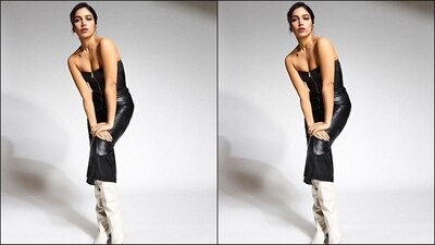 Bhumi's sleeveless dress from Isabel Marant features a latex fabric, a plunging neckline, a zip fastening, a bodycon fit and a midi hemline. She teamed it with thigh-high white boots for a chic look. (Instagram/@bhumipednekar) Bhumi's sleeveless dress from Isabel Marant features a latex fabric, a plunging neckline, a zip fastening, a bodycon fit and a midi hemline. She teamed it with thigh-high white boots for a chic look. (Instagram/@bhumipednekar)