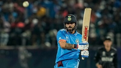 Virat Kohli playing a shot during the ICC Men's World Cup 2023 match between India and New Zealand at HPCA Stadium in Dharamshala. (PTI) Virat Kohli playing a shot during the ICC Men's World Cup 2023 match between India and New Zealand at HPCA Stadium in Dharamshala. (PTI)