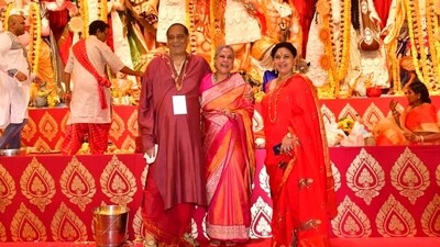 Jaya Bachchan was in a jolly mood on Sunday and was seen having a laugh with the puja host. She looked stunning in an orange silk saree and had her bun adorned with flowers. Jaya Bachchan was in a jolly mood on Sunday and was seen having a laugh with the puja host. She looked stunning in an orange silk saree and had her bun adorned with flowers. 