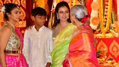 Kajol having a conversation with her Kabhi Khushi Kabhie Gham co-star Jaya Bachchan as her son Yug Devgn and sister Tanishaa Mukerji look on. All of them took part in the Durga Puja celebrations in Mumbai on Sunday. Kajol having a conversation with her Kabhi Khushi Kabhie Gham co-star Jaya Bachchan as her son Yug Devgn and sister Tanishaa Mukerji look on. All of them took part in the Durga Puja celebrations in Mumbai on Sunday. 