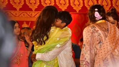 Kajol and son Yug Devgn take a moment to share a hug during the Durga Puja celebrations on Sunday. He had accompanied Kajol on Saturday as well and was spotted touching feet of the elderly. Kajol and son Yug Devgn take a moment to share a hug during the Durga Puja celebrations on Sunday. He had accompanied Kajol on Saturday as well and was spotted touching feet of the elderly. 