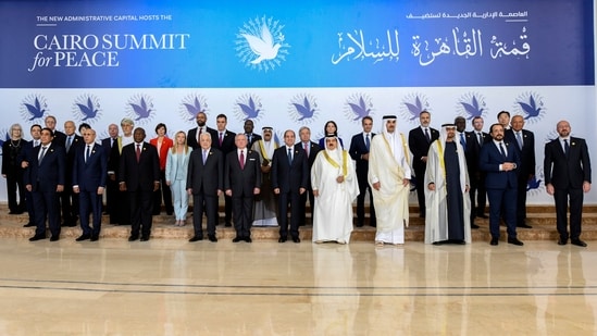 In this photo provided by Egypt's presidency media office, participants of the International Peace Summit pose for a group picture at the New Administrative Capital, just outside Cairo on October 21. (AP)