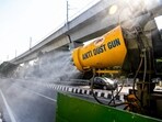 An anti-dust gun sprays water droplets to curb air pollution in New Delhi.