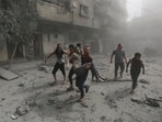 Israel-Hamas War: Palestinians evacuate a wounded man following Israeli airstrikes on Gaza City. Israel-Hamas War: Palestinians evacuate a wounded man following Israeli airstrikes on Gaza City.