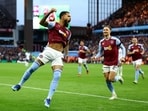 Aston Villa's Douglas Luiz celebrates scoring their second goal with Matty Cash.
