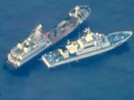 A Chinese militia vessel, top, near Philippine coast guard vessel BRP Cabra as they approach Second Thomas Shoal, locally called Ayungin Shoal, at the disputed South China Sea. A Chinese militia vessel, top, near Philippine coast guard vessel BRP Cabra as they approach Second Thomas Shoal, locally called Ayungin Shoal, at the disputed South China Sea.