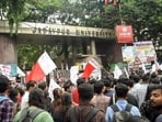Supporters of Left Front student organisations protest in front of the Jadavpur University campus in Kolkata over the death of a first-year student. (ANI Photo)