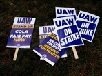 A "UAW On Strike" sign held on a picket line outside the Stellantis Sterling Heights Assembly Plant in Sterling Heights, Michigan, US, on Monday, Oct. 23, 2023. UAW union members at Stellantis NVs lucrative pickup truck plant, which makes the Ram 1500 pickup truck, walked off the job Monday morning.