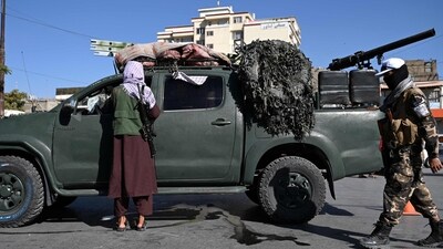 Afghanistan: Taliban fighters stand guard as they block a road near Kabul. (AFP) Afghanistan: Taliban fighters stand guard as they block a road near Kabul. (AFP)