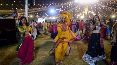 Performers dance Garba during the Navaratri in Ahmedabad on October 21. (AFP) Performers dance Garba during the Navaratri in Ahmedabad on October 21. (AFP)