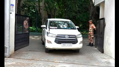 Income tax officials coming out of the residence of Rajinder Gupta, chairman of Trident Group, in Ludhiana on Tuesday. (Manish/HT)