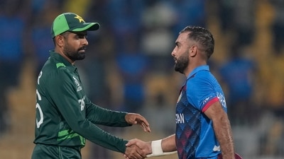 Afghanistan's captain Hashimatullah Shahidi, right, shakes hands with Pakistan's captain Babar Azam after their win during the ICC Men's Cricket World Cup match (AP) Afghanistan's captain Hashimatullah Shahidi, right, shakes hands with Pakistan's captain Babar Azam after their win during the ICC Men's Cricket World Cup match (AP)