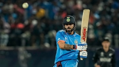 Virat Kohli plays a shot during the ICC Men's World Cup ODI cricket match between India and New Zealand. (PTI)