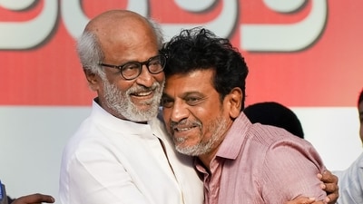 Actors Rajinikanth hugs actor Shiva Rajkumar during a ceremony for the Karnataka Ratna Award presentation. (PTI) Actors Rajinikanth hugs actor Shiva Rajkumar during a ceremony for the Karnataka Ratna Award presentation. (PTI)