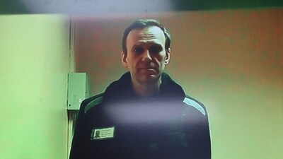 Russian opposition leader Alexei Navalny is seen on a screen via video link. (Reuters)