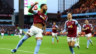 Aston Villa's Douglas Luiz celebrates scoring their second goal with Matty Cash. (REUTERS)