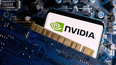 A smartphone with a displayed NVIDIA logo is placed on a computer motherboard. (REUTERS)
